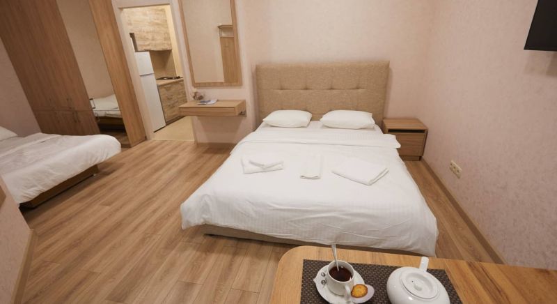 Кровать в 4-х местном номере отеля Вилла Мира в Алуште, Крым